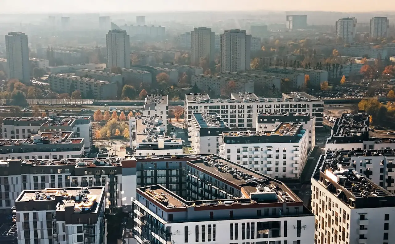 Services Aerial view of modern apartments in Poznań, showcasing urban living and architecture.